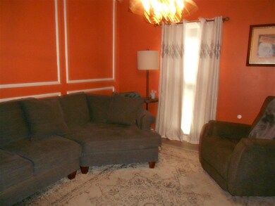 THE FORMAL DINING ROOM IS SEPARATED FROM THE LIVIN