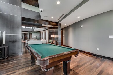 Recreation room with wood finished floors, pool t