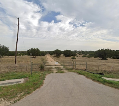 View of street with a gate and a rural view