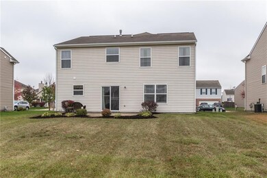Paver patio off rear of home overlooks neighborhood walking path.
