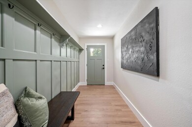 Mudroom with light LVP flooring