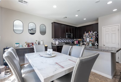 Dining space featuring recessed lighting and visib