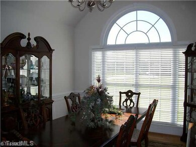 Dining Room. Elegant Formal Dining Room with Cathedral Ceiling, Chair Rail w/ picture frame mldg. below, Double Window for lots of natural light.