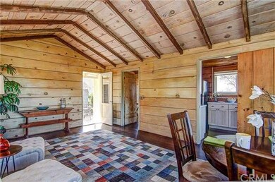 Original wood paneled walls and ceiling add warmth
