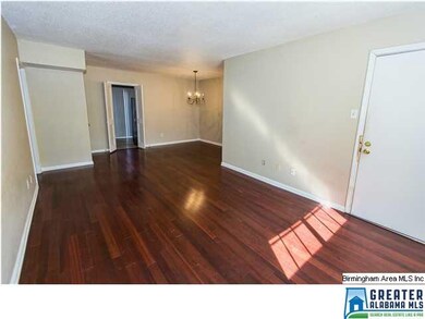 Nice, bright living/dining room with rich, hardwoo