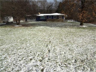 Exterior Front. The home is set back from the road