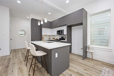 Here is a view of the kitchen and the entryway fro