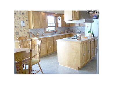 Good sized Kitchen with plenty of maple cabinets a