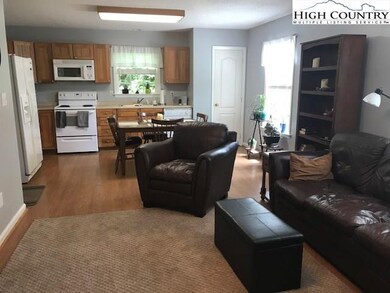 View 2 of living into kitchen area, with pantry cl