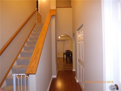 2 story entrance with laundry room to the right