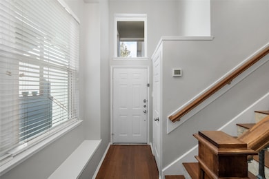 Step into the inviting foyer, showcasing soaring h