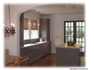 French Doors from the Kitchen lead to the Enchanti