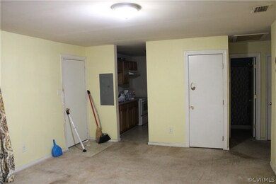 Unfurnished bedroom with a closet, connected bathroom, and light colored carpet
