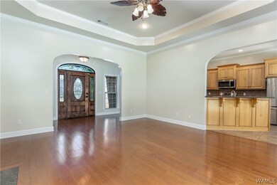 Family room has unique wide arched entrances from