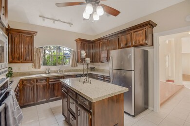 Kitchen has tons of cabinetry and an amazing view of the front yard!