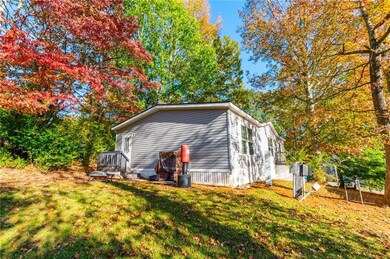 View of side entry and backyard of home featuring 