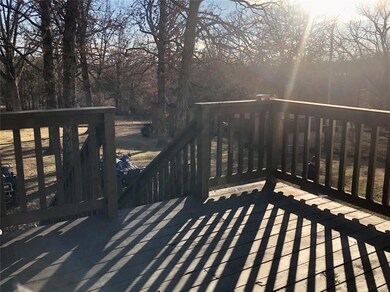 The large deck overlooks the backyard and has two 