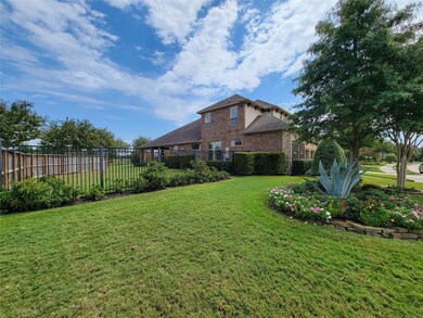 Home is sitting on a fabulously landscaped12457 sq