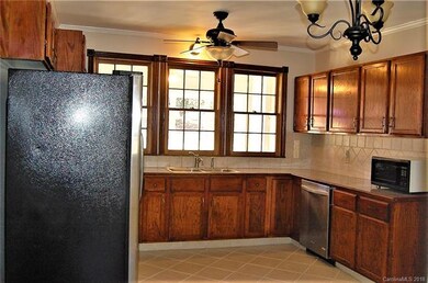 Granite tile countertops, ceramic tile floor and b