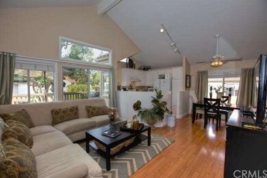 Open living area with vaulted ceilings & lots of n