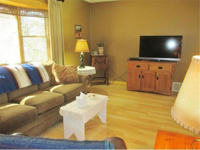 Main Floor Living Room with Large Bay window captu