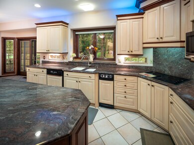 Kitchen with custom cabinets/lighting