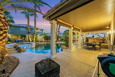 View of pool with a patio area, a fenced backyard,