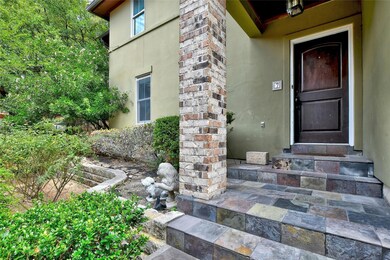 View of exterior entry featuring stucco siding