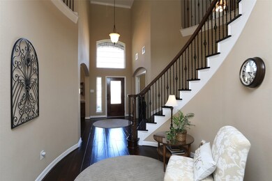 Nice high ceilings and note the gorgeous wood flooring!