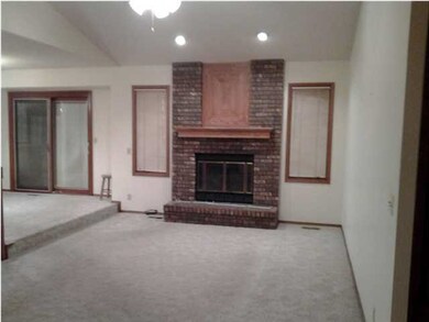 Floor to ceiling brick columns and tall windows su