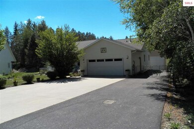 Street view of the attached garage..Concrete apron