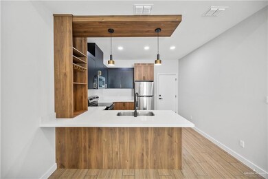 Laundry area with water heater, independent washer and dryer, and laundry area