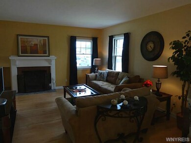 Living Room Newer windows, wood burning fireplace 