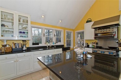 Kitchen with corner window seat.