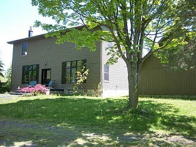 Exterior Front. SIDE VIEW SHOWING PART OF THE YARD