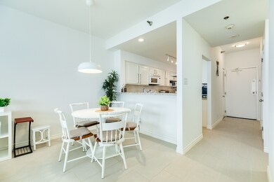 Open concept with kitchen, dining & living areas.