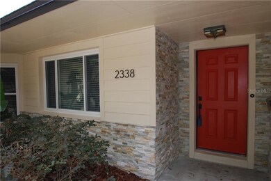 New stacked stone flanks the garage and frames the
