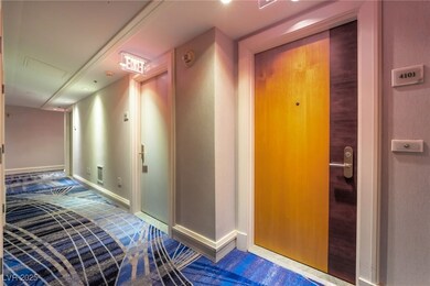 Hallway featuring baseboards and visible vents
