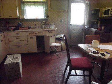 Kitchen. Large kitchen has door to backyard and ga
