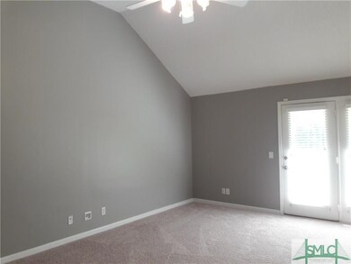 open great room with vaulted ceilings & new carpet