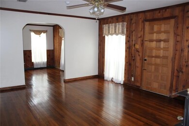 LIVING ROOM: Opens to the spacious dining room