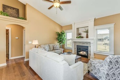 Gorgeous gas fireplace with custom wood trim and s