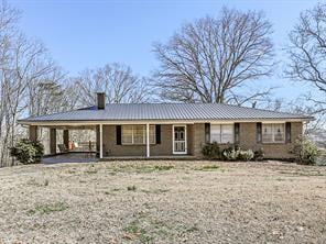 Ranch-style house with a carport