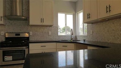 Sparkling Black Granite Counters & Malibu White Ca