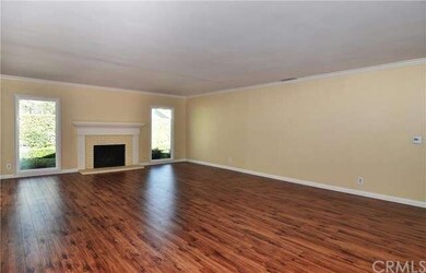 Great Room with gorgeous flooring, crown molding a