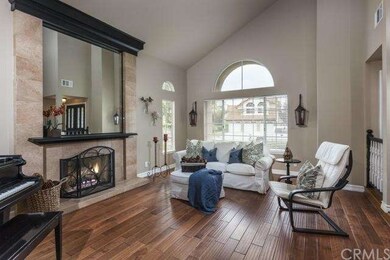 Formal living room with fireplace, high ceilings l