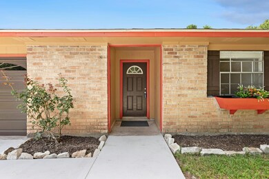 Entrance to property featuring brick siding