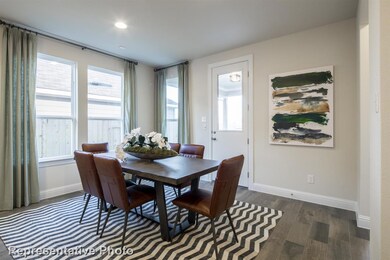 Dining room featuring dark wood finished floors a