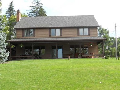 Exterior Front Front of Cottage from lake view/cov
