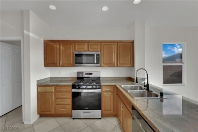 Kitchen featuring appliances with stainless steel